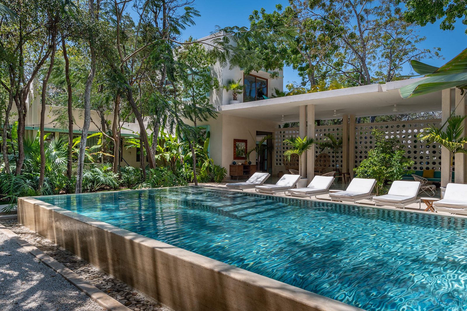 Mid-Century Hotel in La Veleta, Tulum: the pool and the lounge pavilion among the trees
