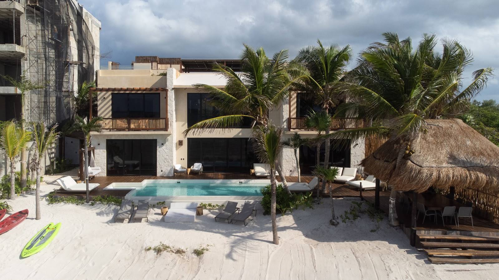The villa and its pool seen from the beach